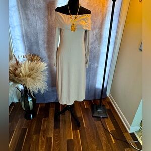 Long sleeve soft off shoulder midi dress with calf slit on left.